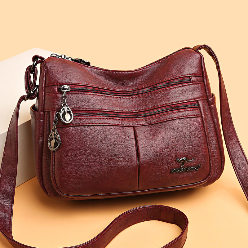Bolso bandolera texturizado multibolsillos