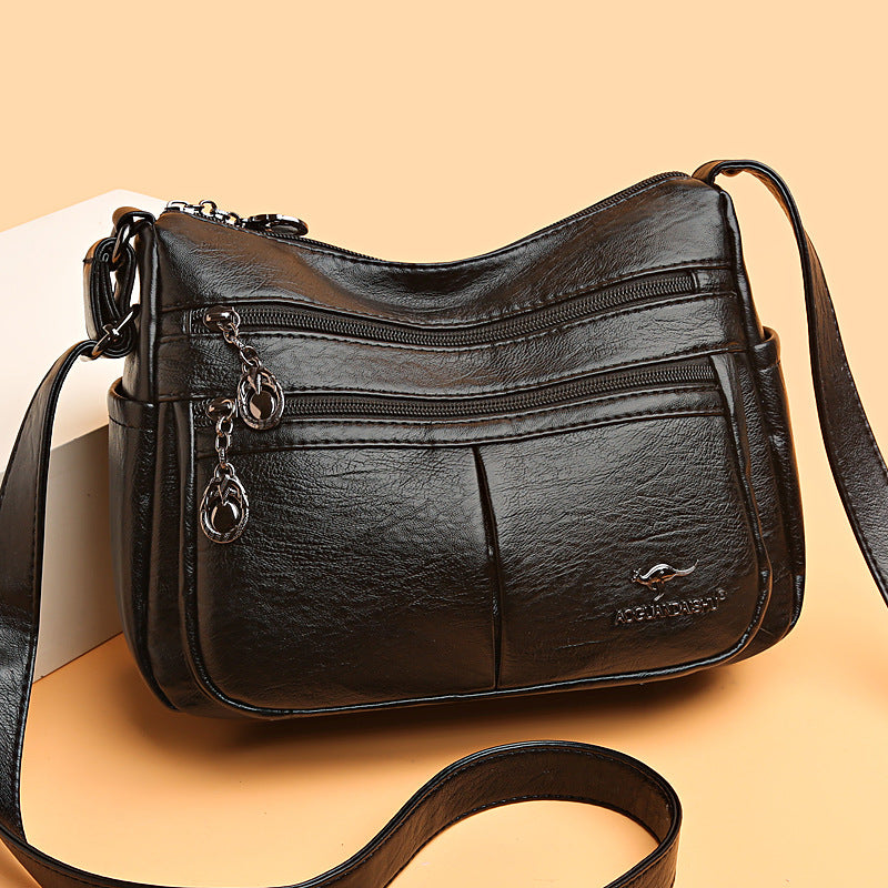 Bolso bandolera texturizado multibolsillos