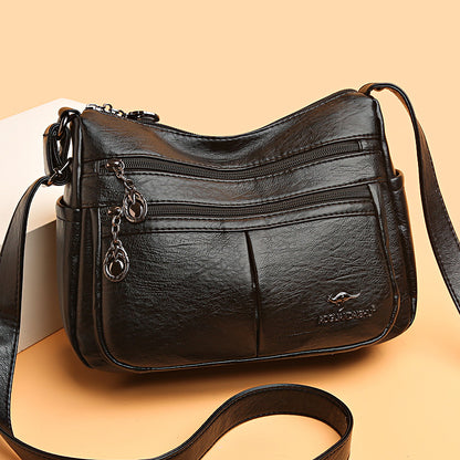 Bolso bandolera texturizado multibolsillos