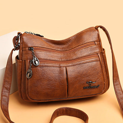 Bolso bandolera texturizado multibolsillos